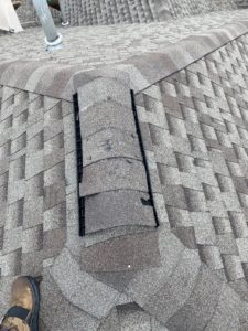 Frisco Roofer Damaged Shingle