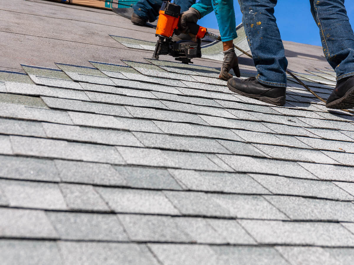 Roofers Installing New Roof on Home in Frisco Texas