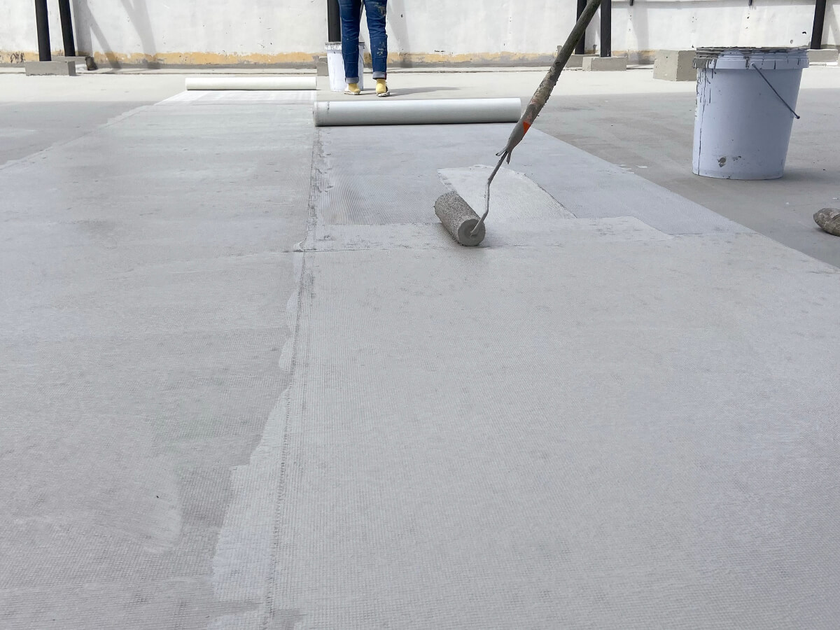 Roofers Applying Reinforced Mesh Rubber Sealant in Frisco Texas