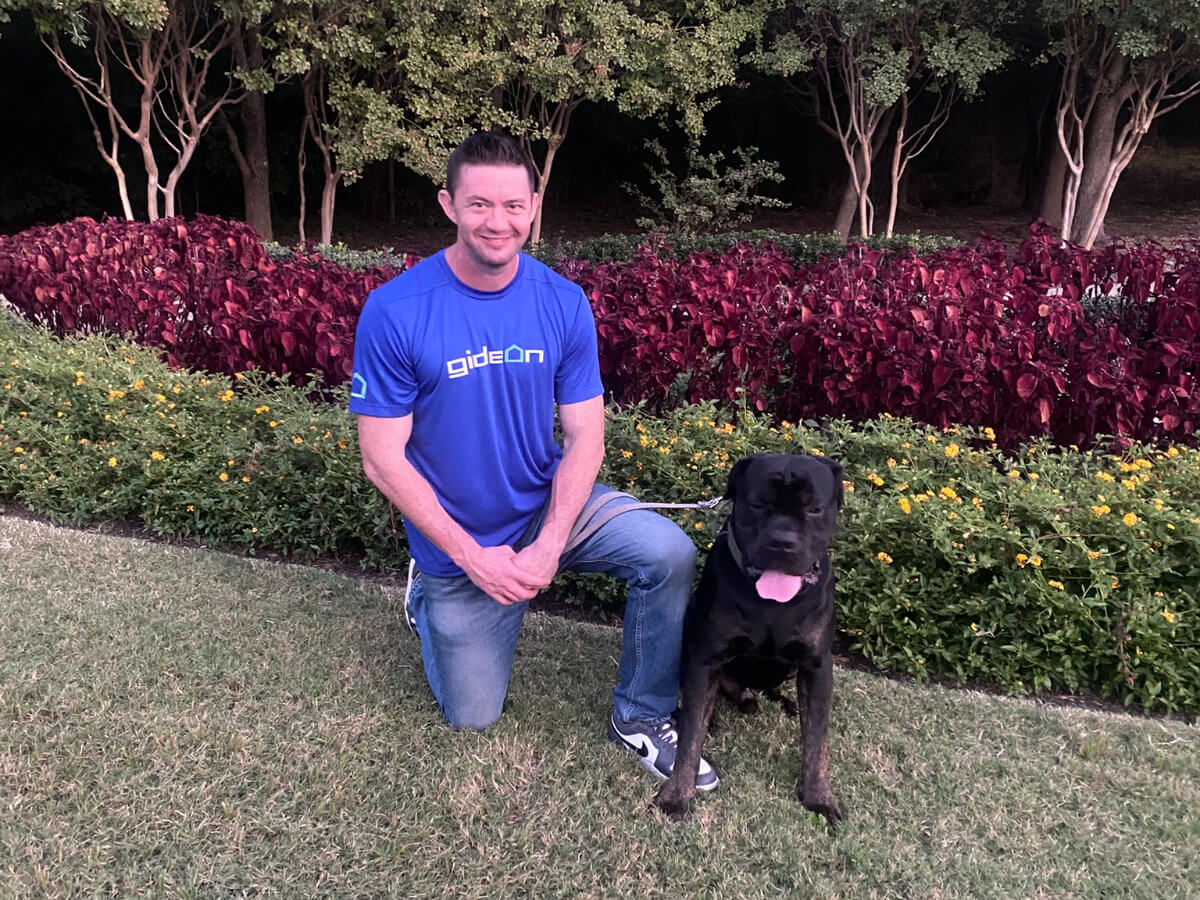 Gideon Bridges, Owner of Gideon Roofing, and Moose, Company Mascot, in Frisco, Texas