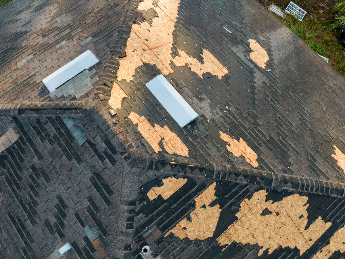 Roof with Asphalt Shingles Missing Following Major Storm in Frisco Texas
