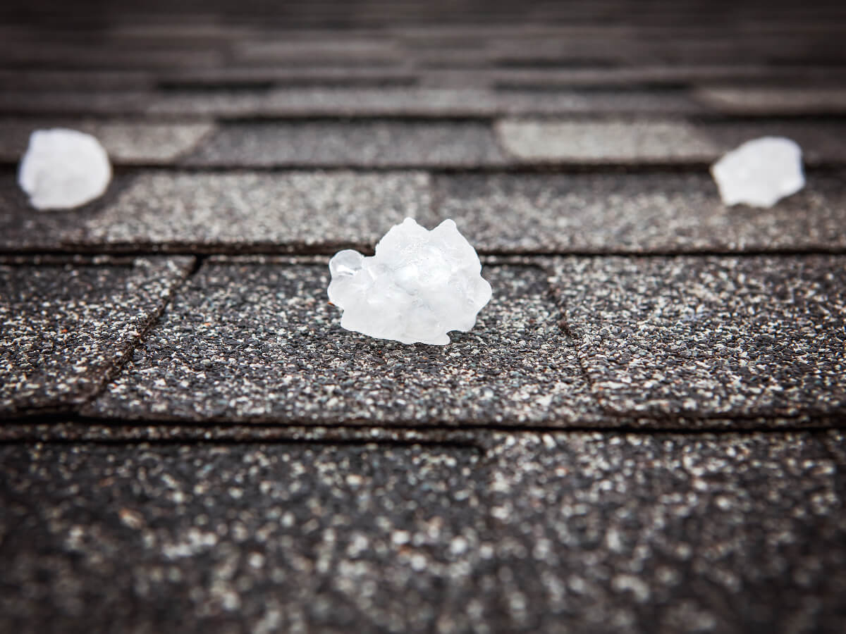 Golf Ball Size Hail on Asphalt Shingle Roof in Frisco Texas