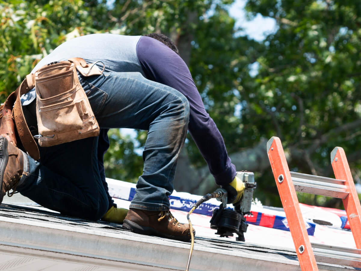 Roofer Repairing Damaged Roof in Frisco Texas